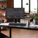 Computer with company data analysis in business office