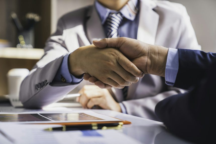 Handshake as successful negotiation ending, Business partnership meeting concept. Image businessmans