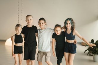 Portrait of a group of children in the fitness room. Children's yoga